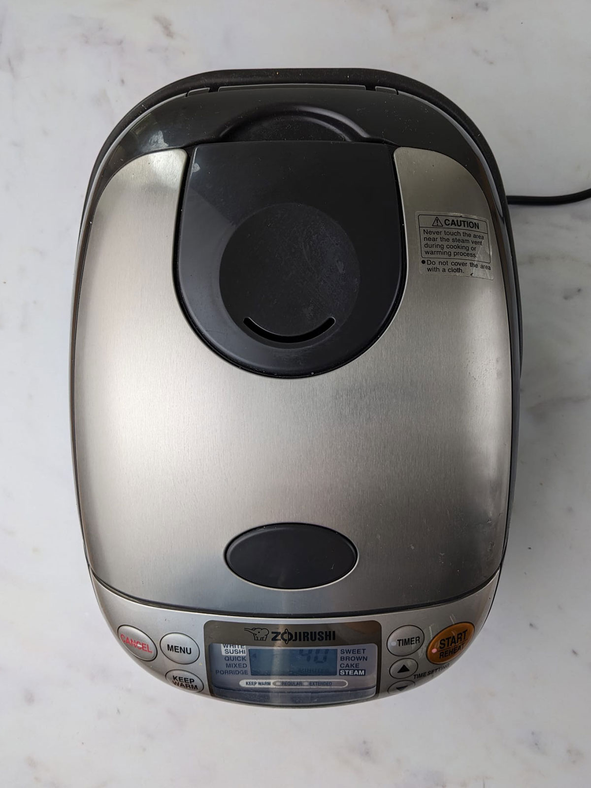 The rice cooker on a white background.