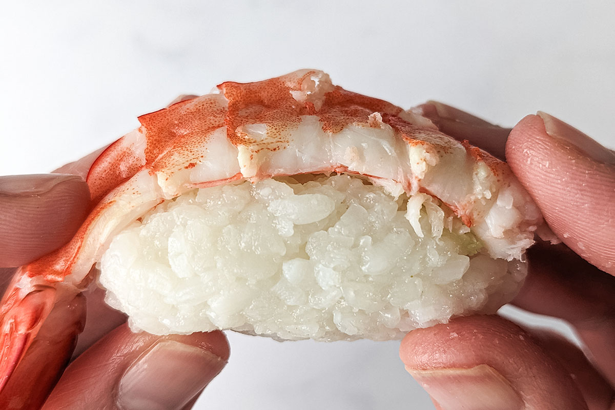 A close up of the finished shrimp nigiri.