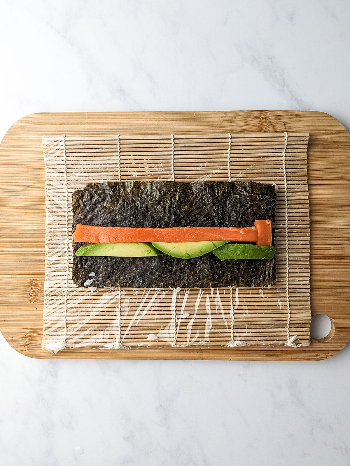 Nori topped with salmon and avocado.