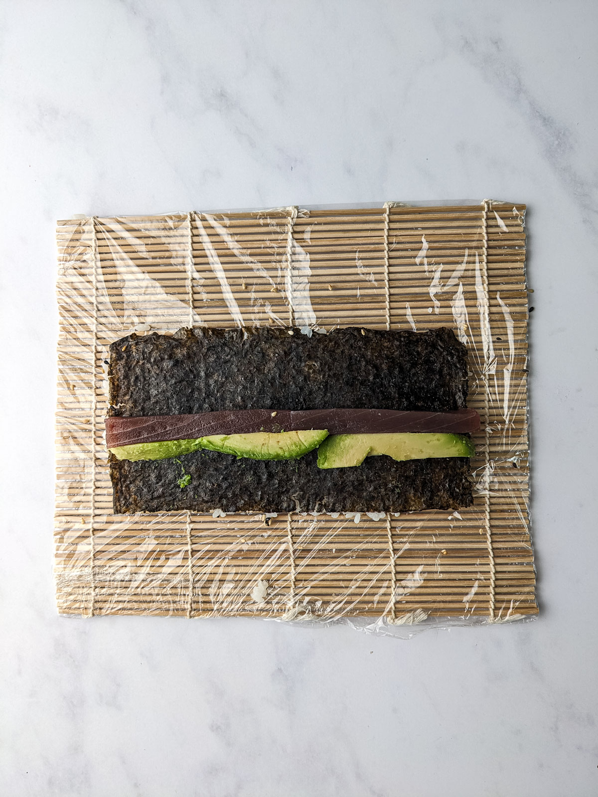 Nori with avocado and cucumber on top.